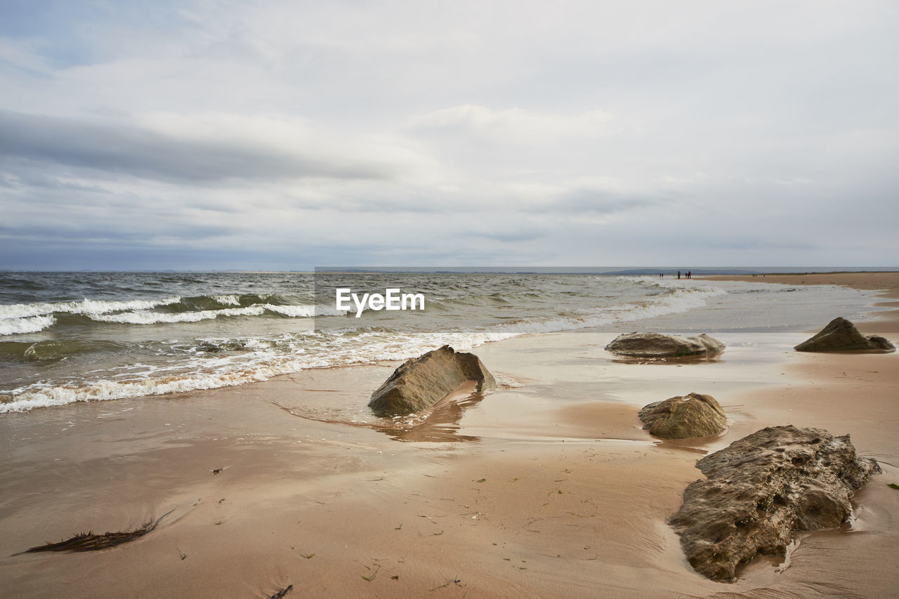 Scenic view of beach against sky