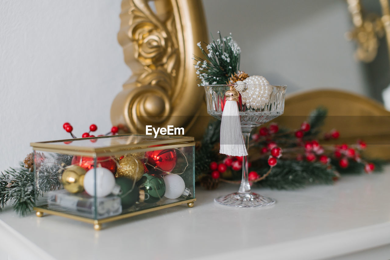 Christmas table decor, glass box with balls and a glass