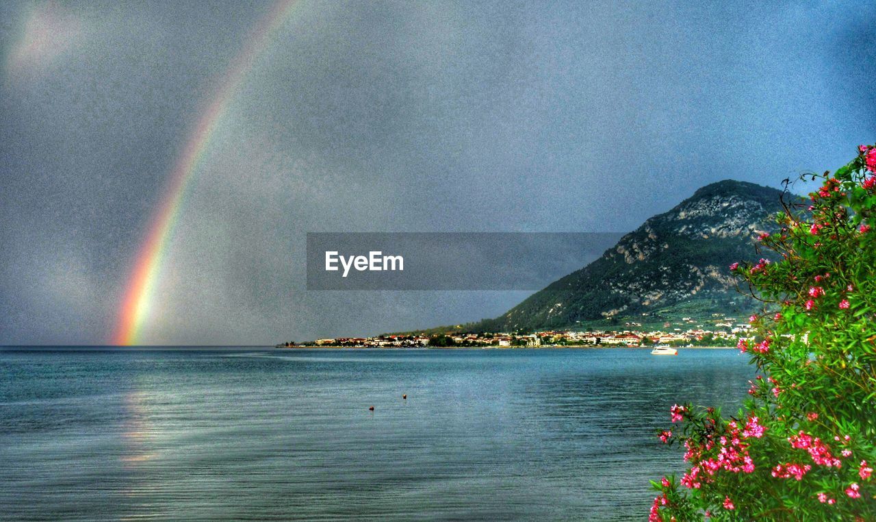 SCENIC VIEW OF RAINBOW OVER SEA