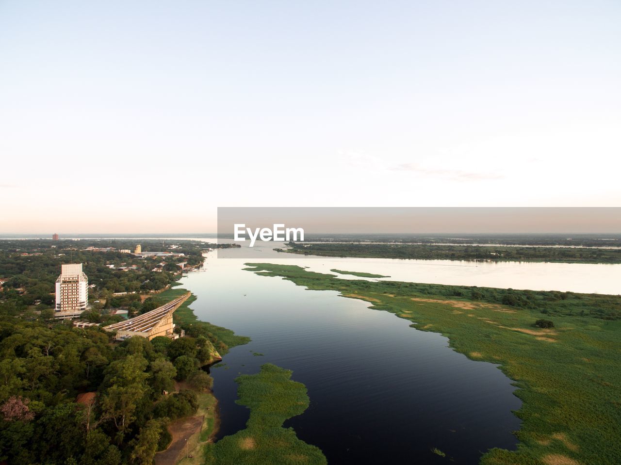 SCENIC VIEW OF SEA BY CITY AGAINST CLEAR SKY