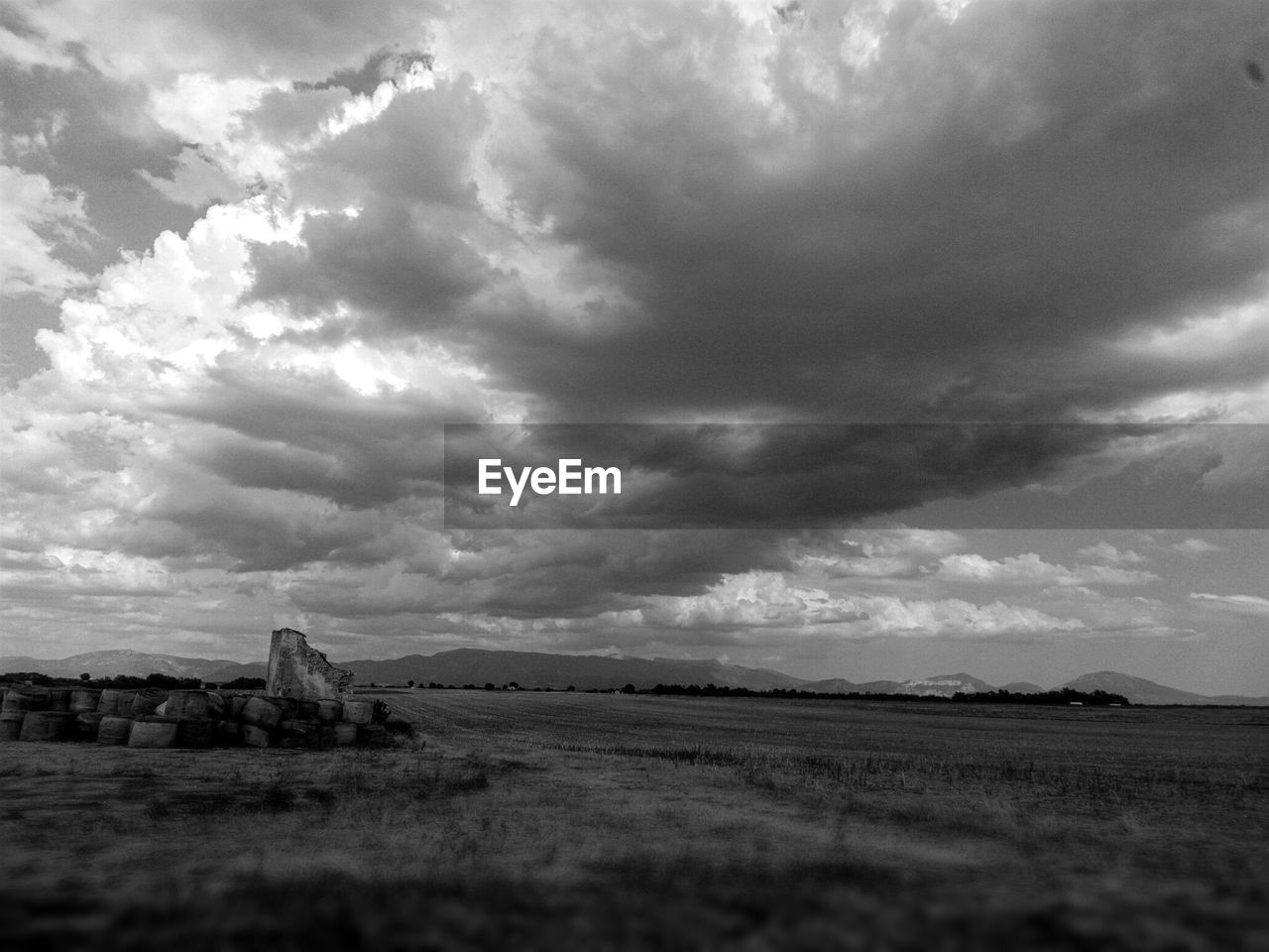 Scenic view of landscape against cloudy sky