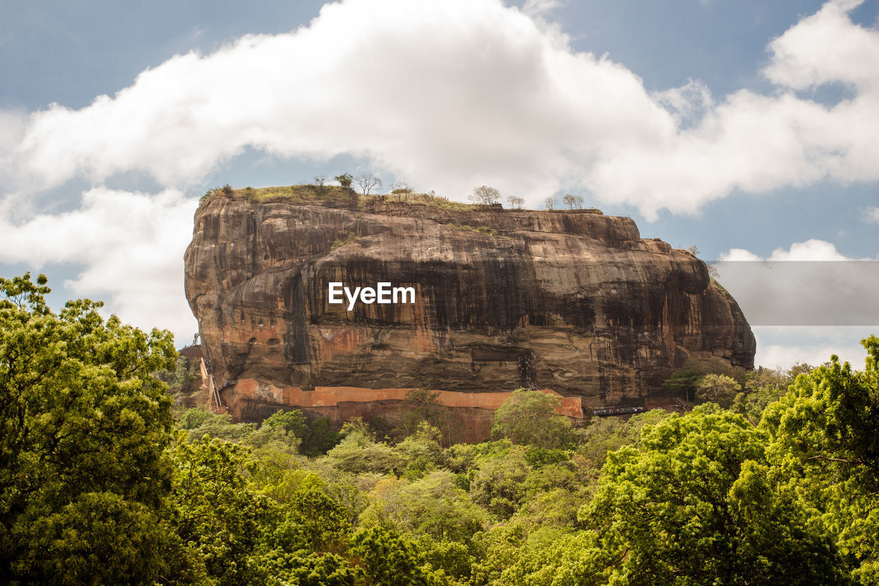 Low angle view of rock formations against sky