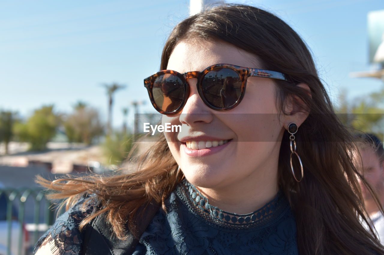 Portrait of young woman wearing sunglasses