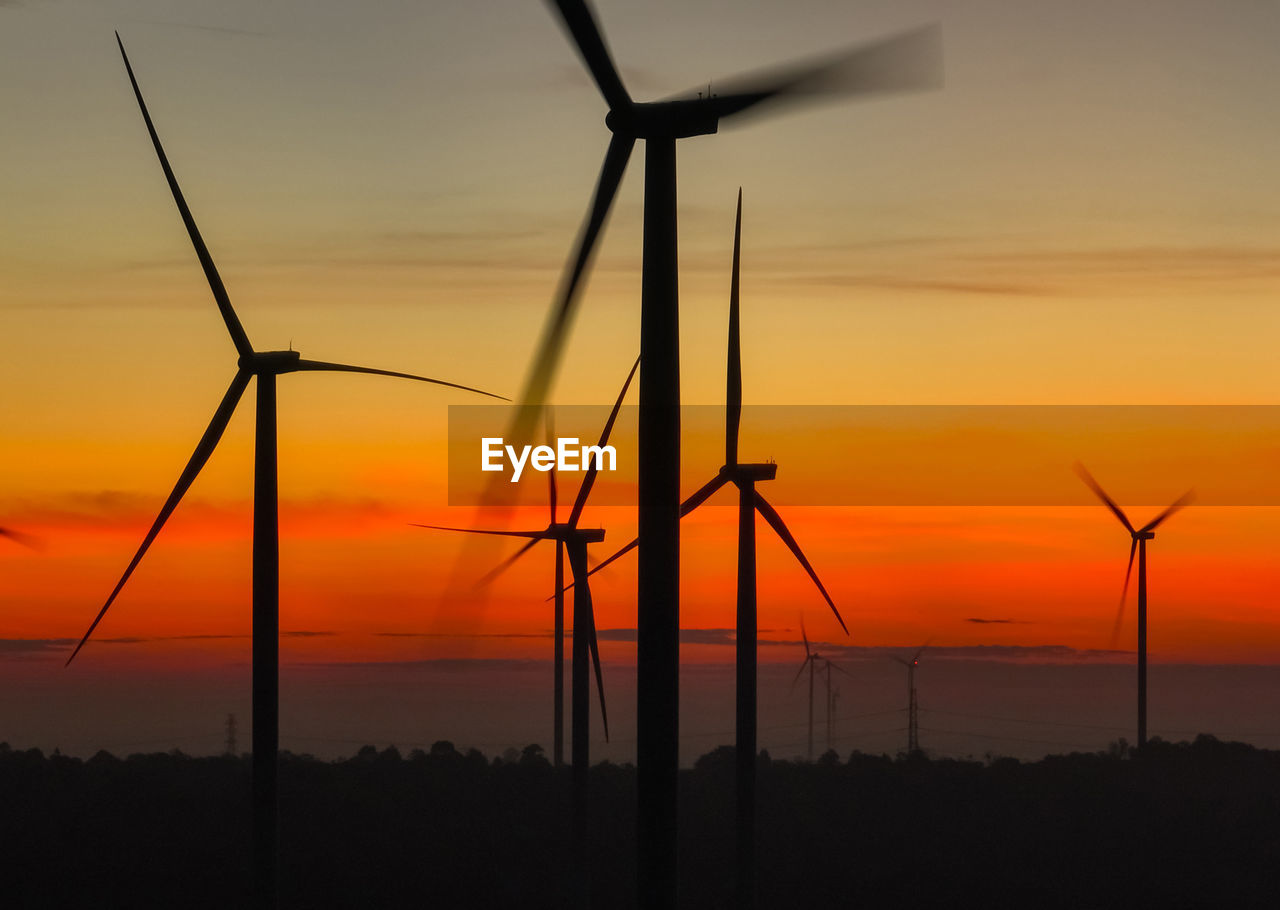 Wind farm landscape against sunset sky. wind energy. wind power. sustainable and renewable energy.