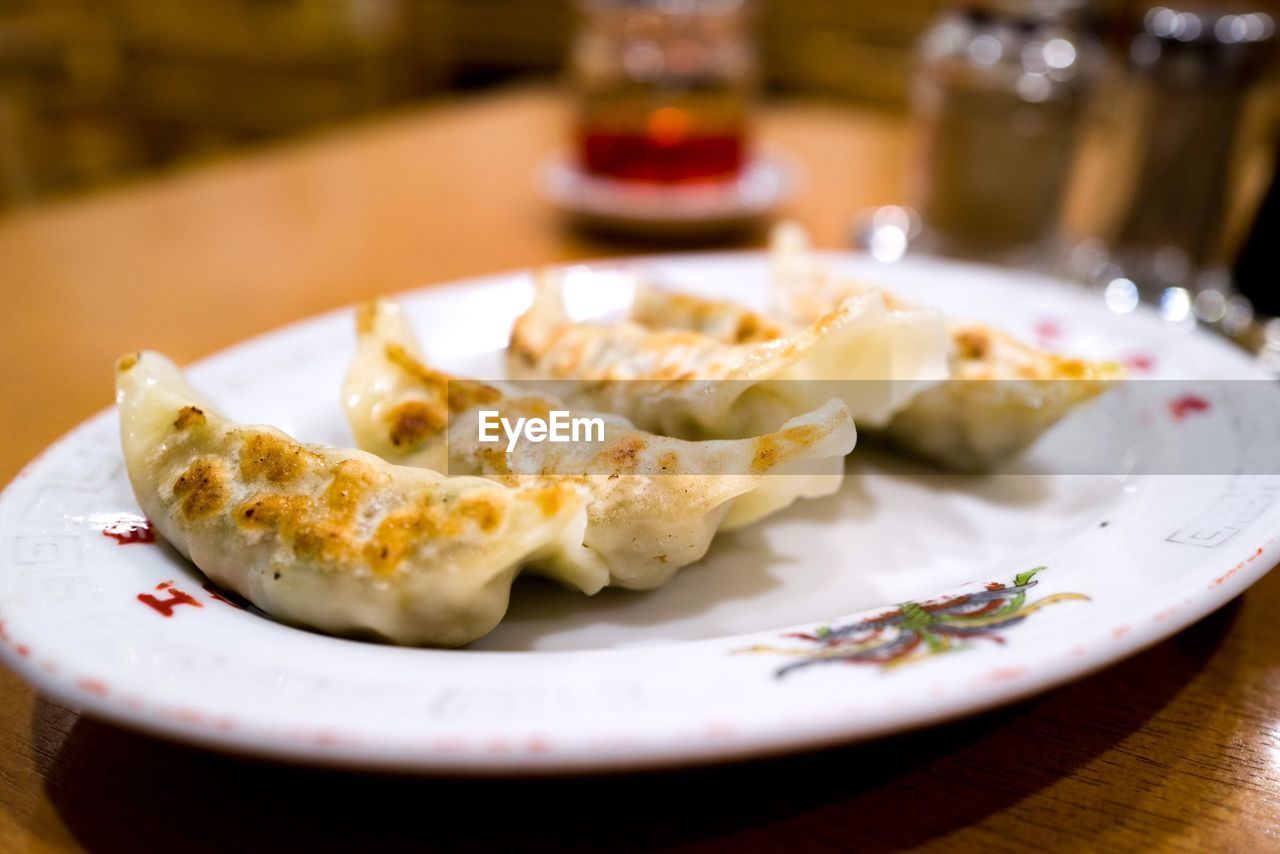 CLOSE-UP OF SERVED FOOD ON TABLE