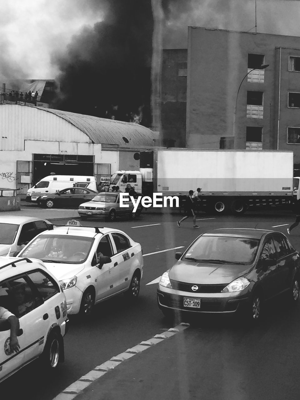 VEHICLES ON ROAD IN CITY