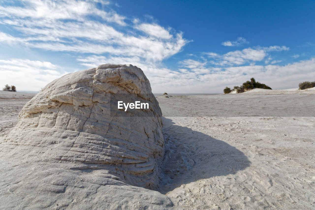 Rock formation on land against sky