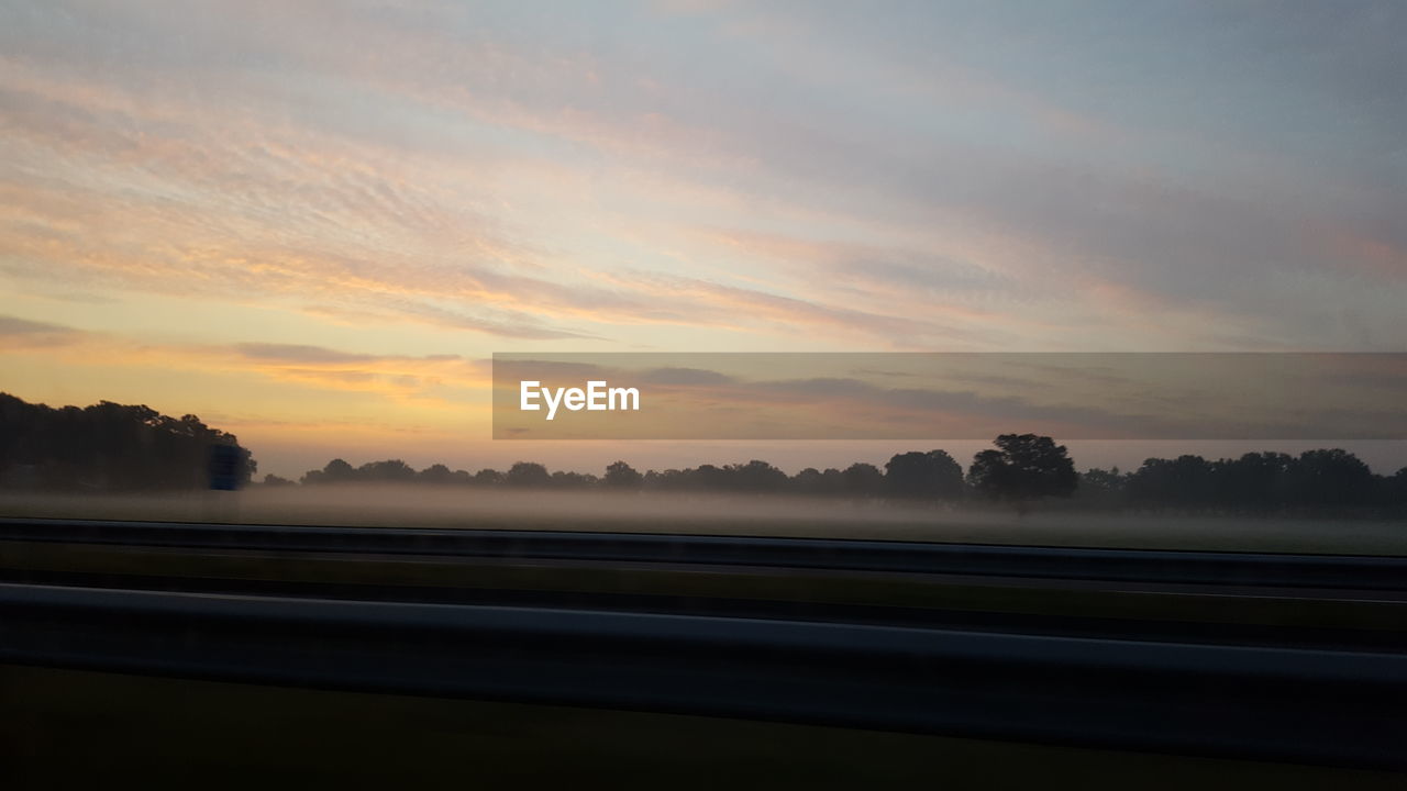 Scenic view of landscape against sky during sunset