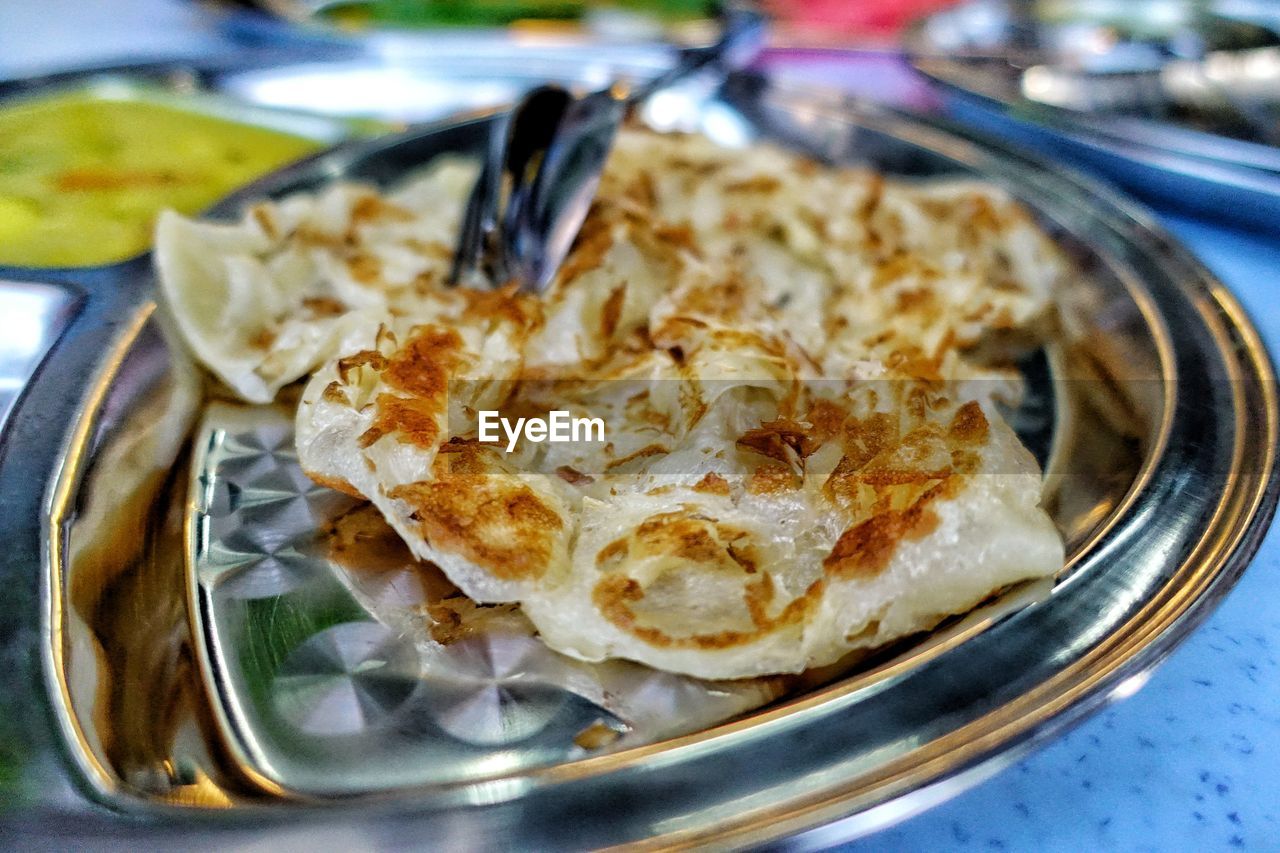 Close-up of naan bread in plate