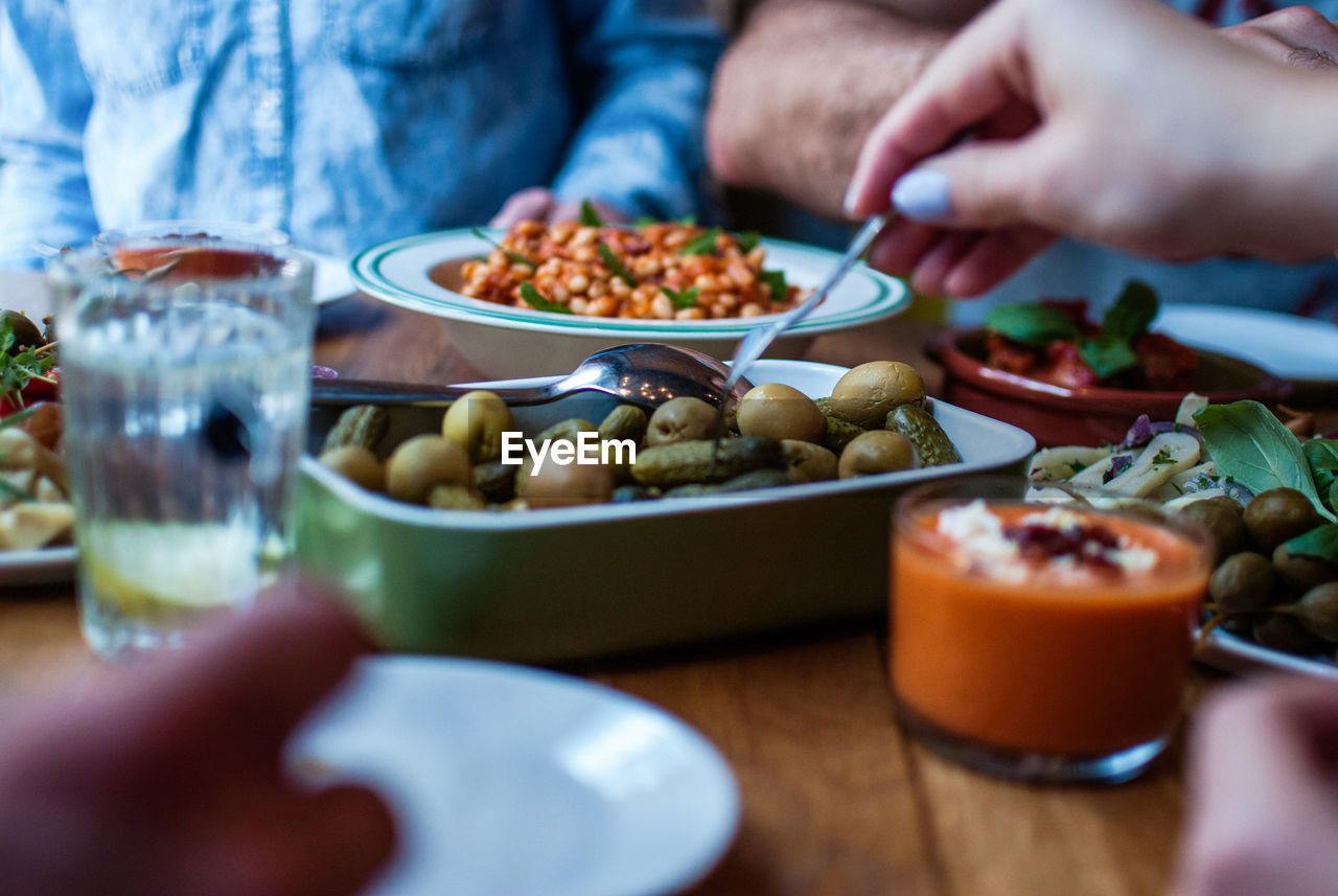 Close-up of friends having food at restaurant