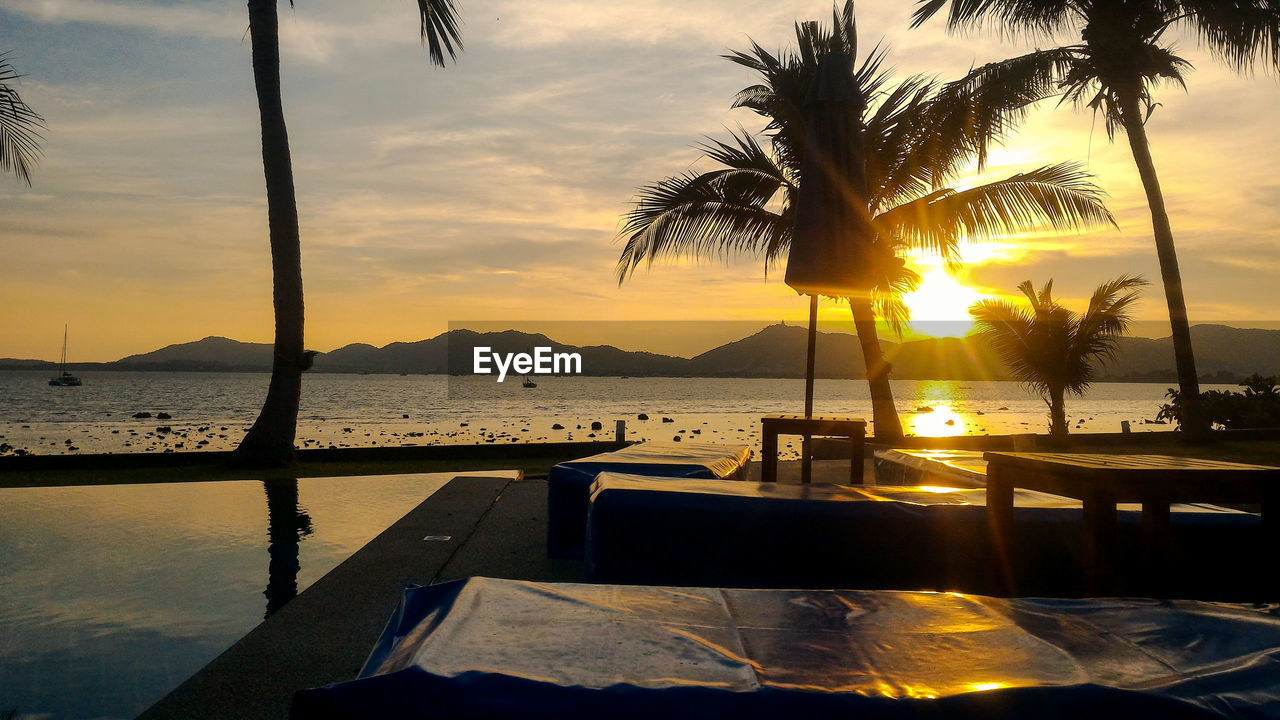 VIEW OF SWIMMING POOL AT SUNSET