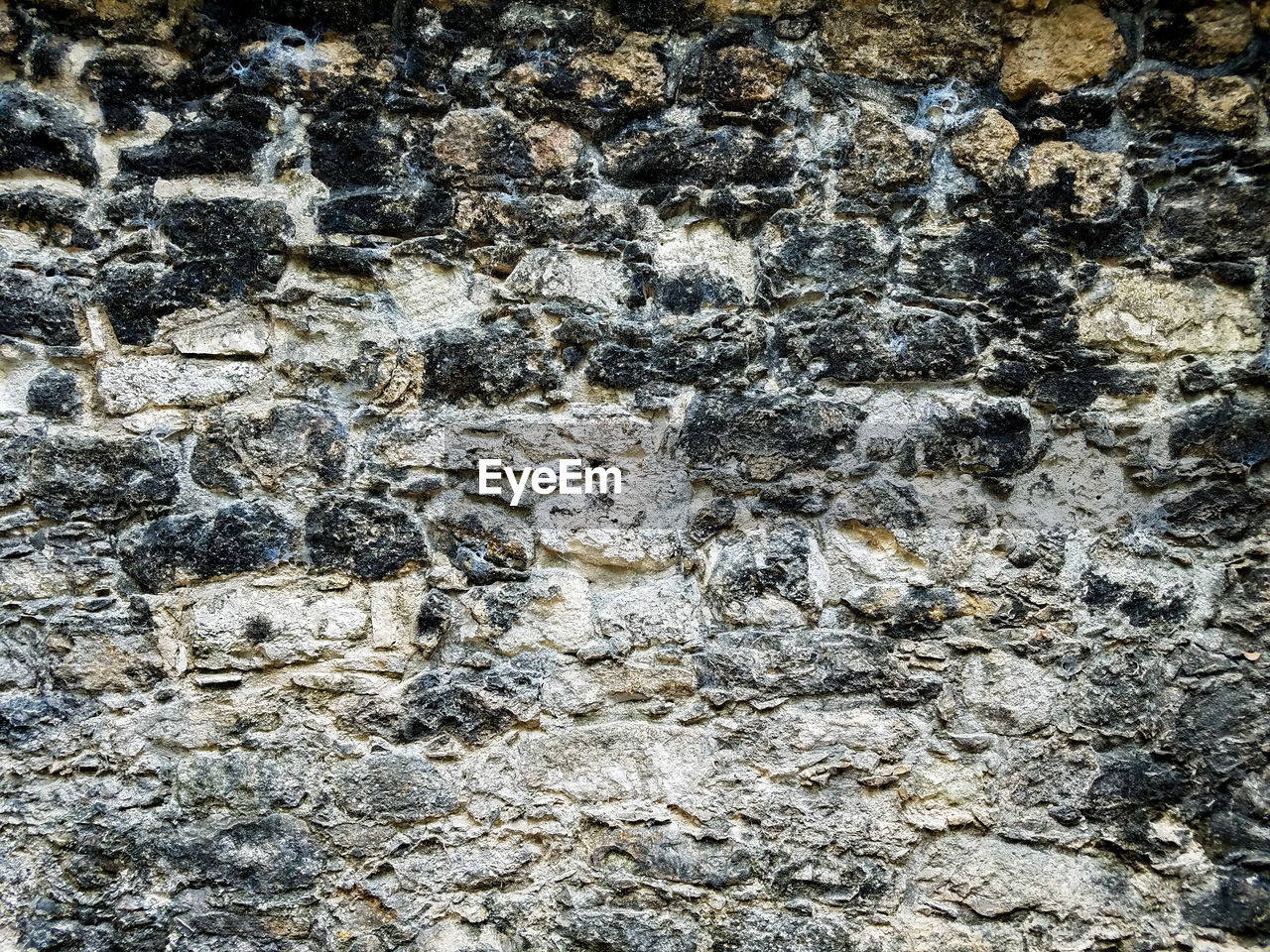 CLOSE-UP OF STONE WALL