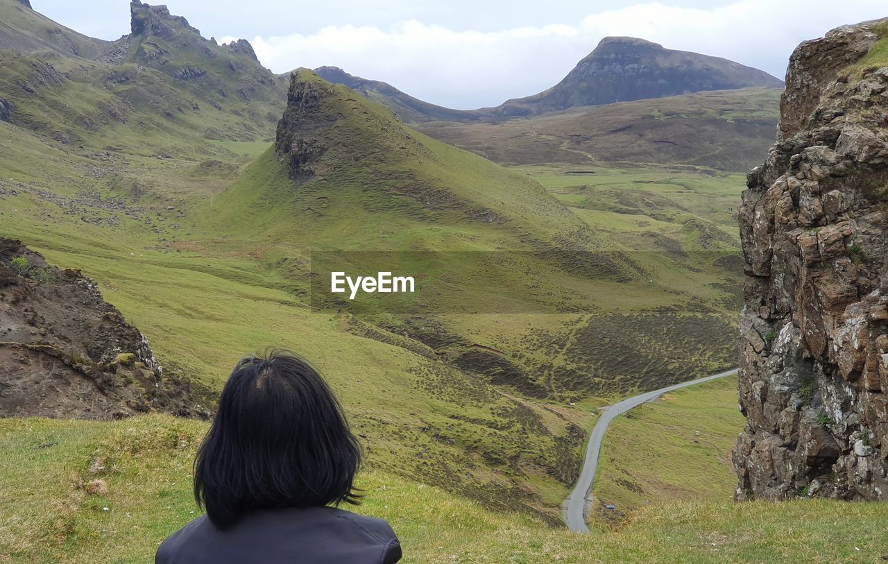 Rear view of woman looking at mountains