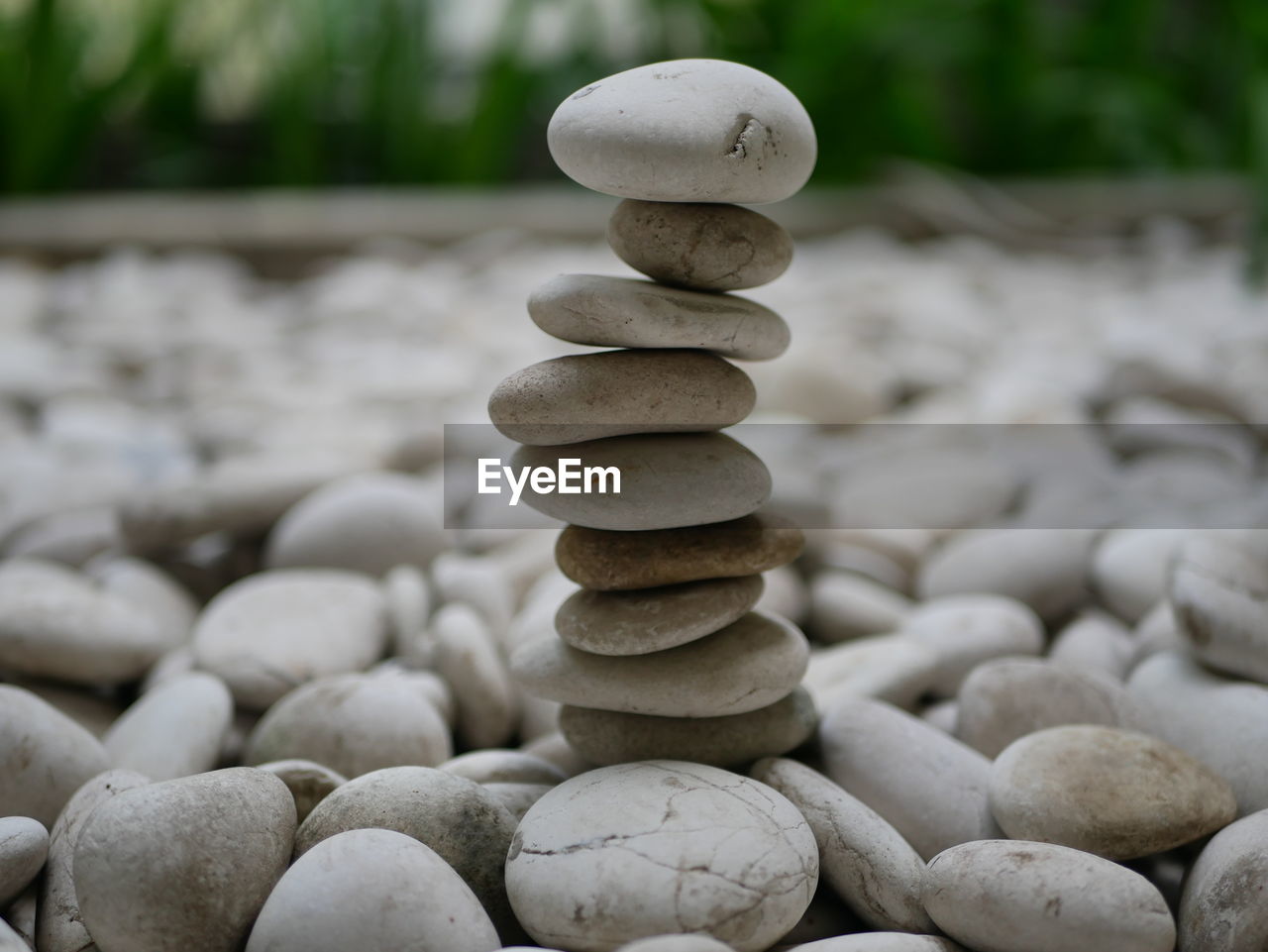 CLOSE-UP OF STONE STACK ON PEBBLES
