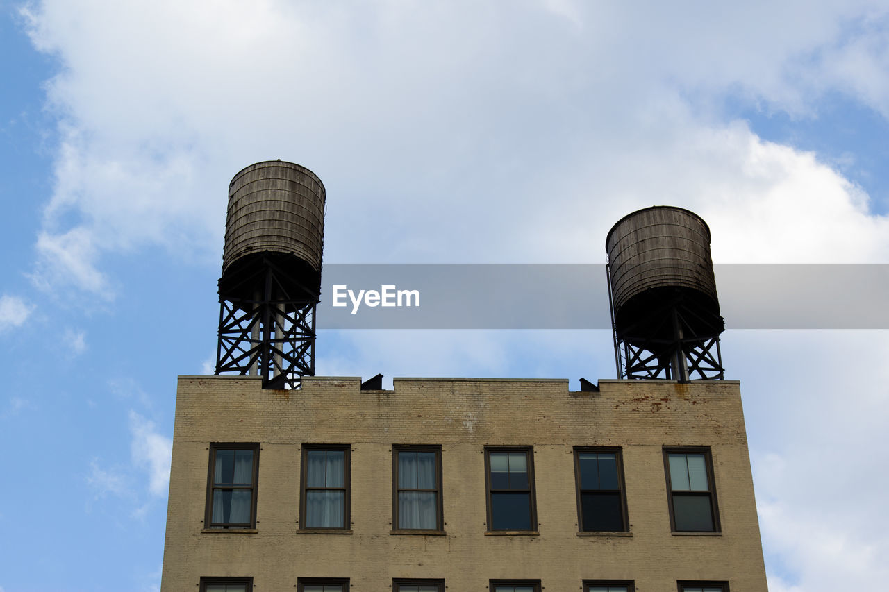 Low angle view of water tower against sky