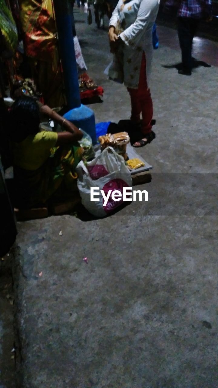 MAN WITH GARBAGE ON THE FLOOR