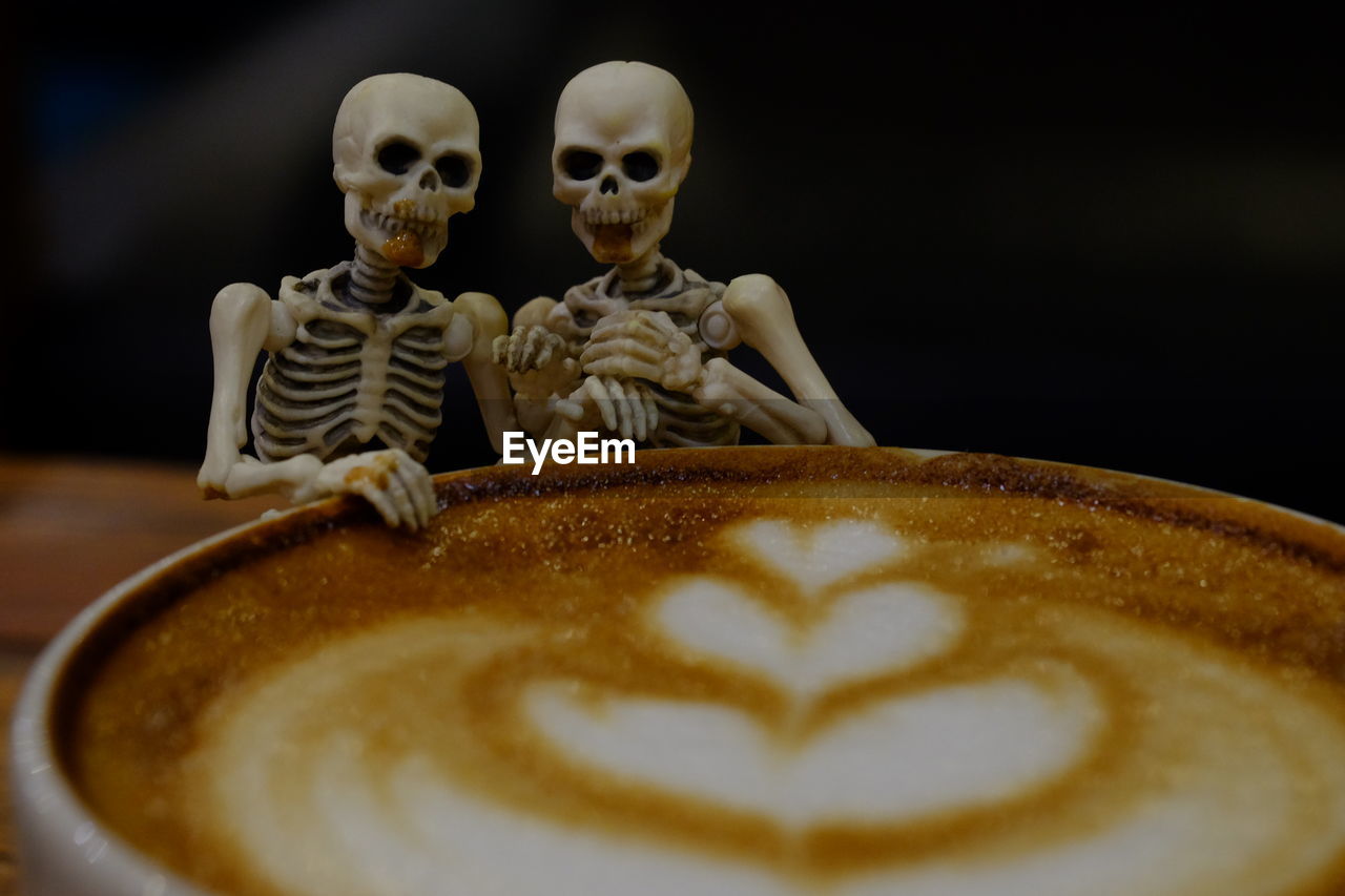 CLOSE-UP OF COFFEE IN CUP ON TABLE AT HOME