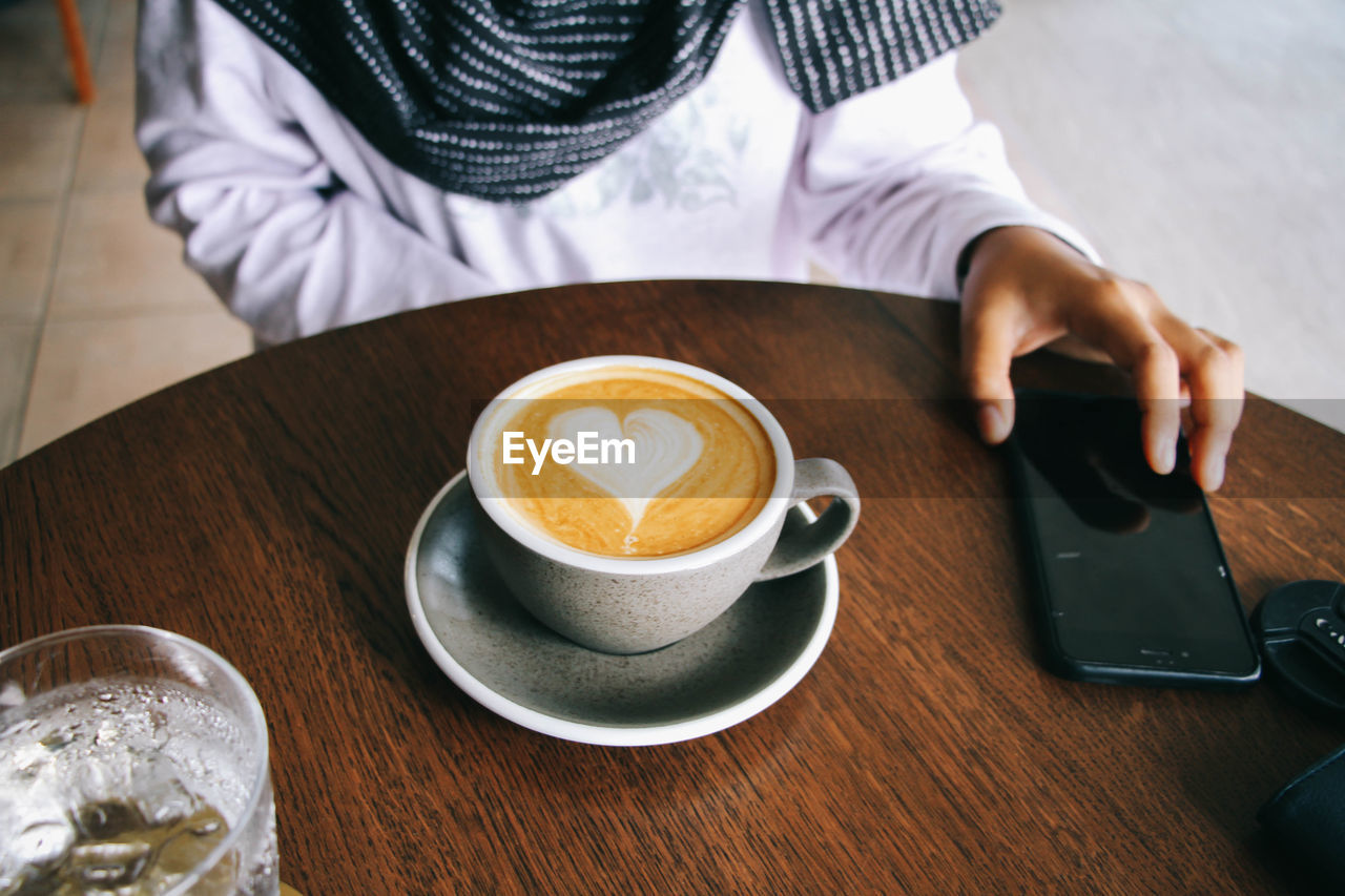 High angle view of coffee cup on table