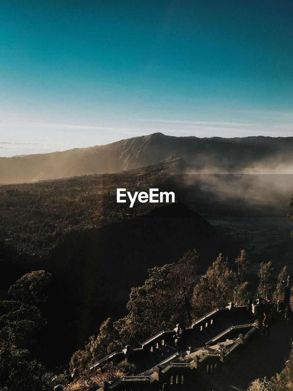 Aerial view of landscape against blue sky in seruni point view bromo mountain 