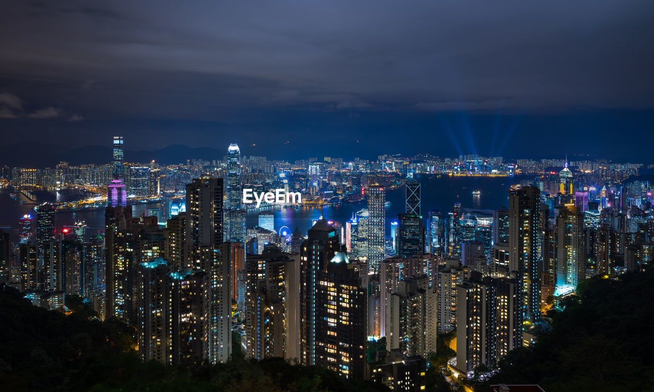 High angle view of city lit up at night