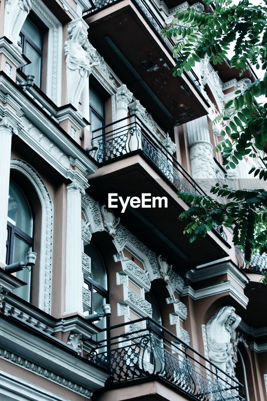 LOW ANGLE VIEW OF STAIRCASE AGAINST BUILDING