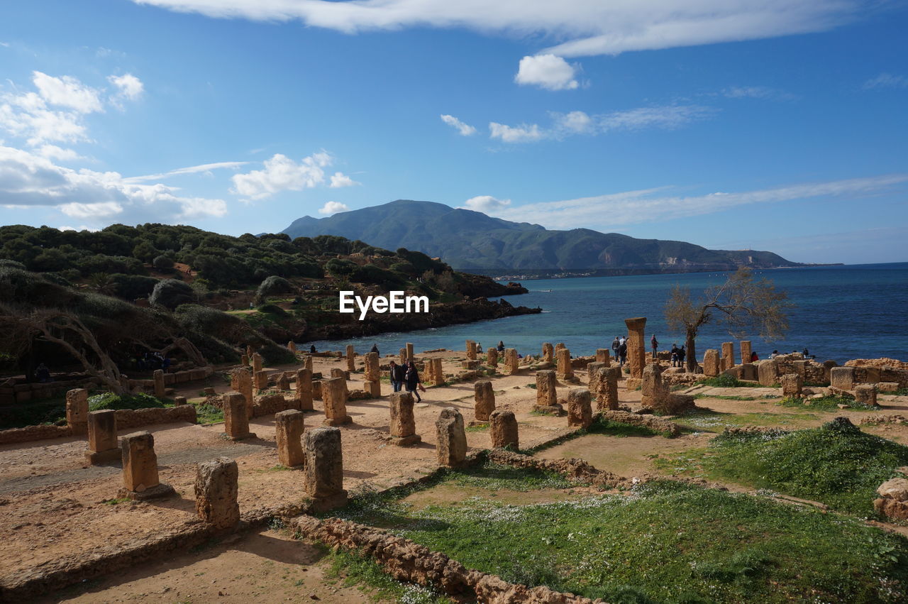 Graveyard by sea against sky