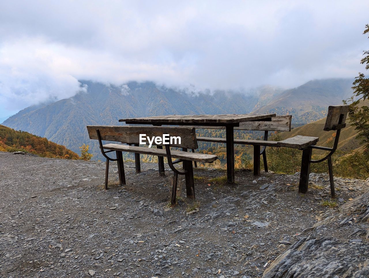 Empty chairs and tables by sea against sky. tusheti, georgia.