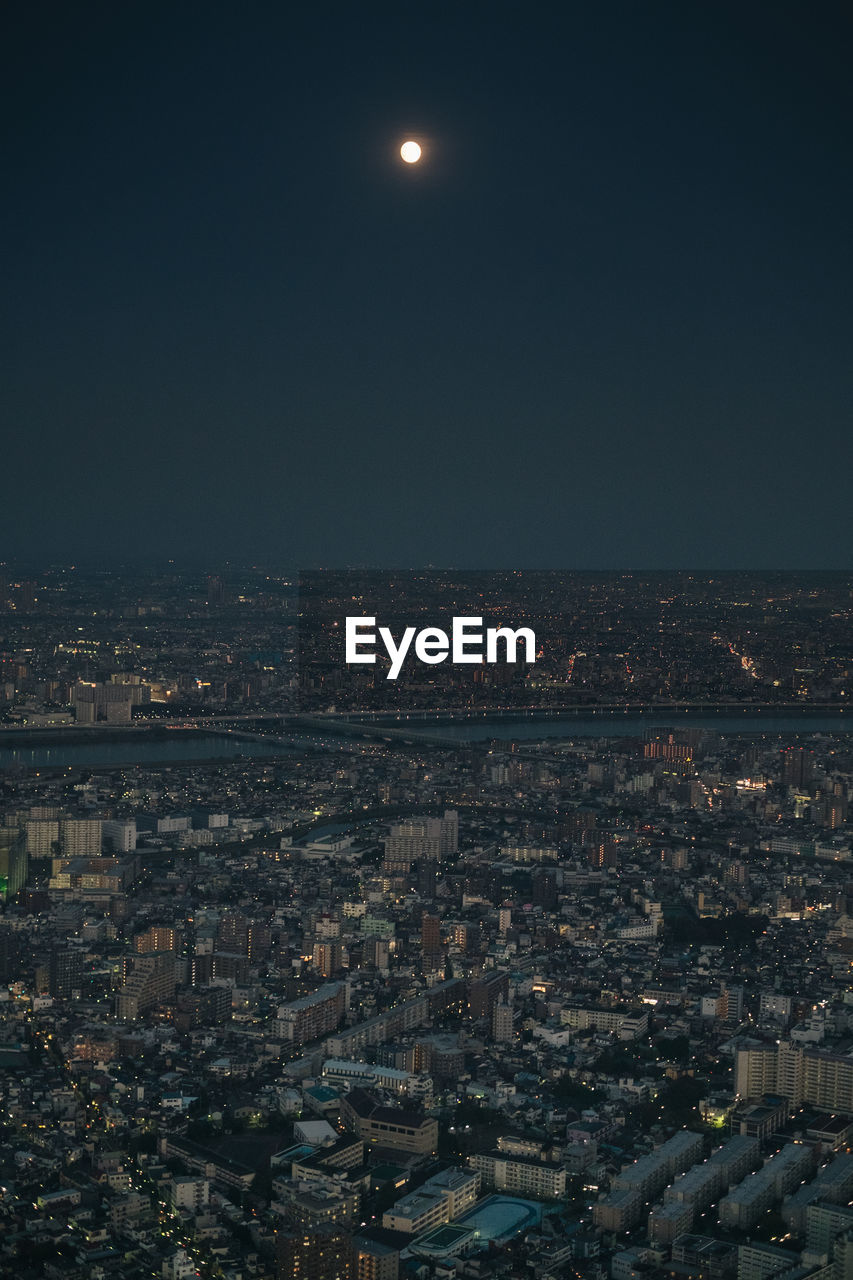 Aerial view of illuminated cityscape at night