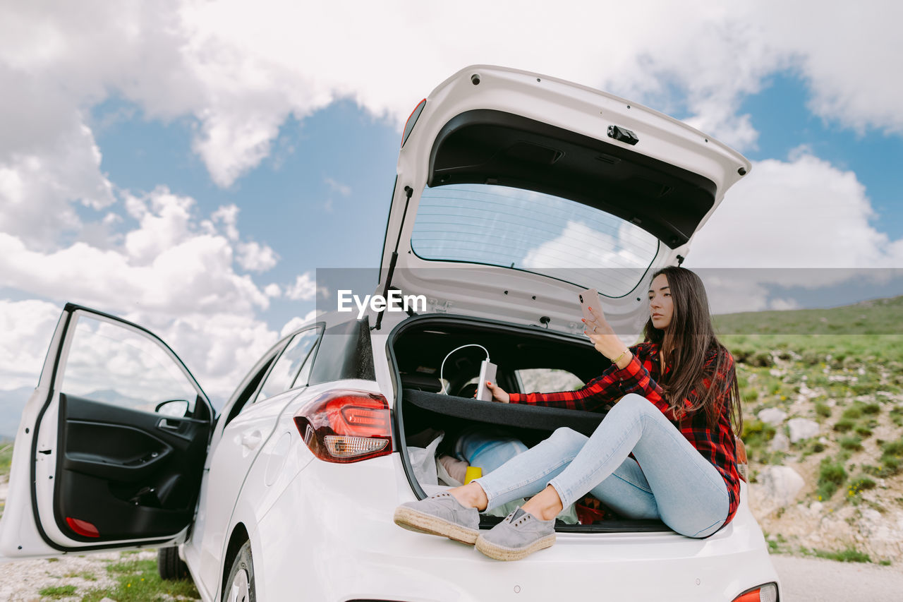 Rear view of man wearing warm clothing while sitting in car