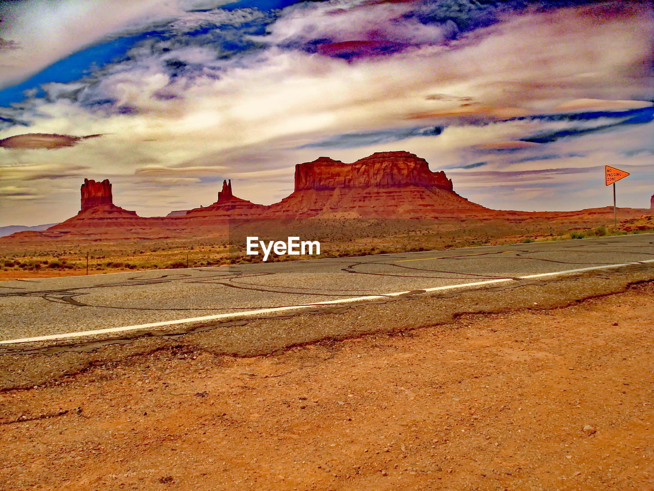 SCENIC VIEW OF MOUNTAINS AGAINST CLOUDY SKY