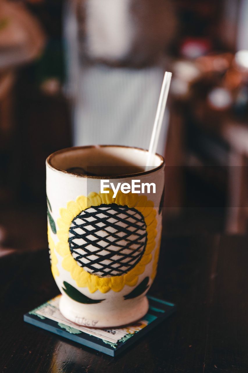 Close-up of drink served on table in cafe