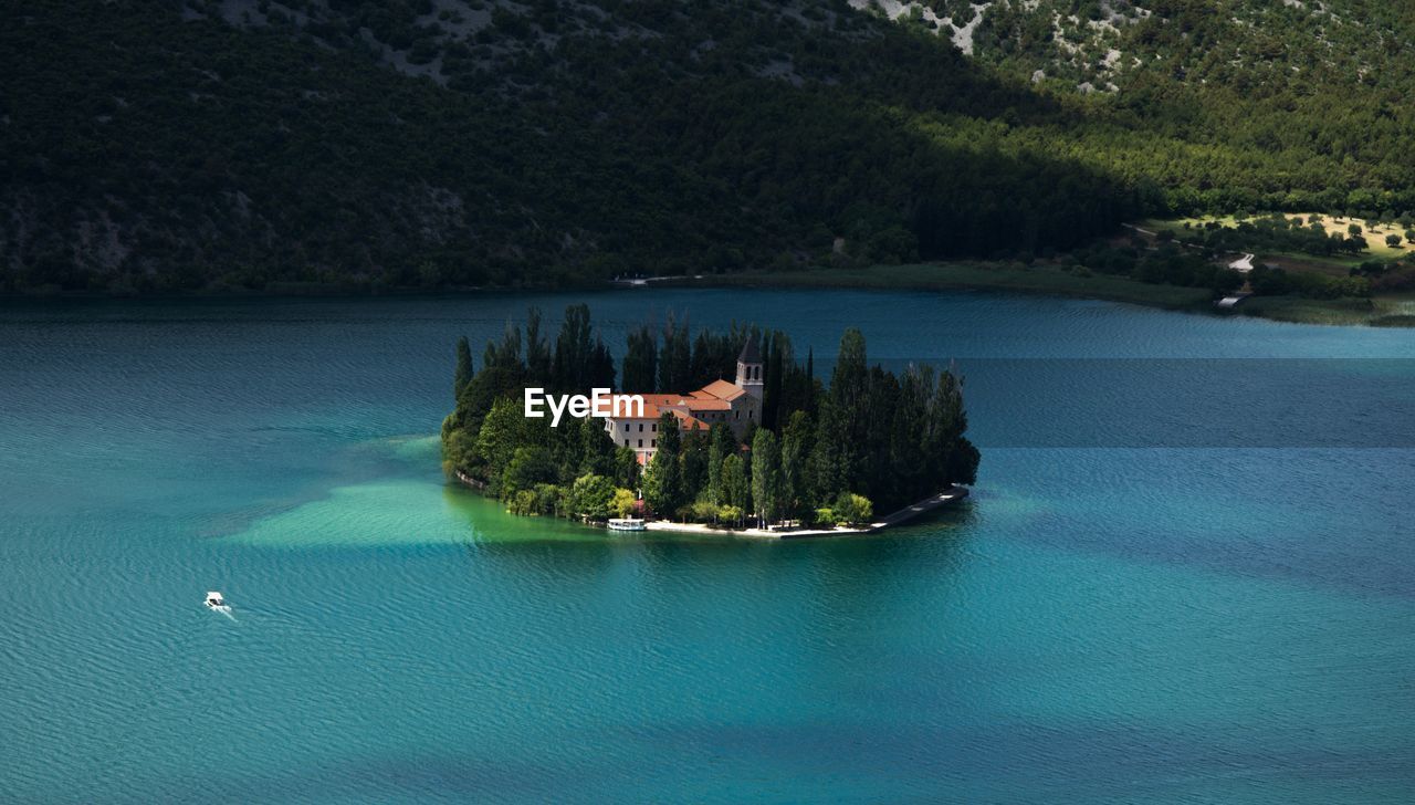 SCENIC VIEW OF LAKE BY TREES