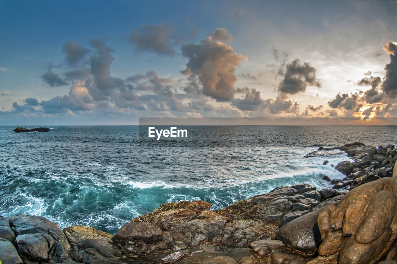 Scenic view of sea against sky during sunset