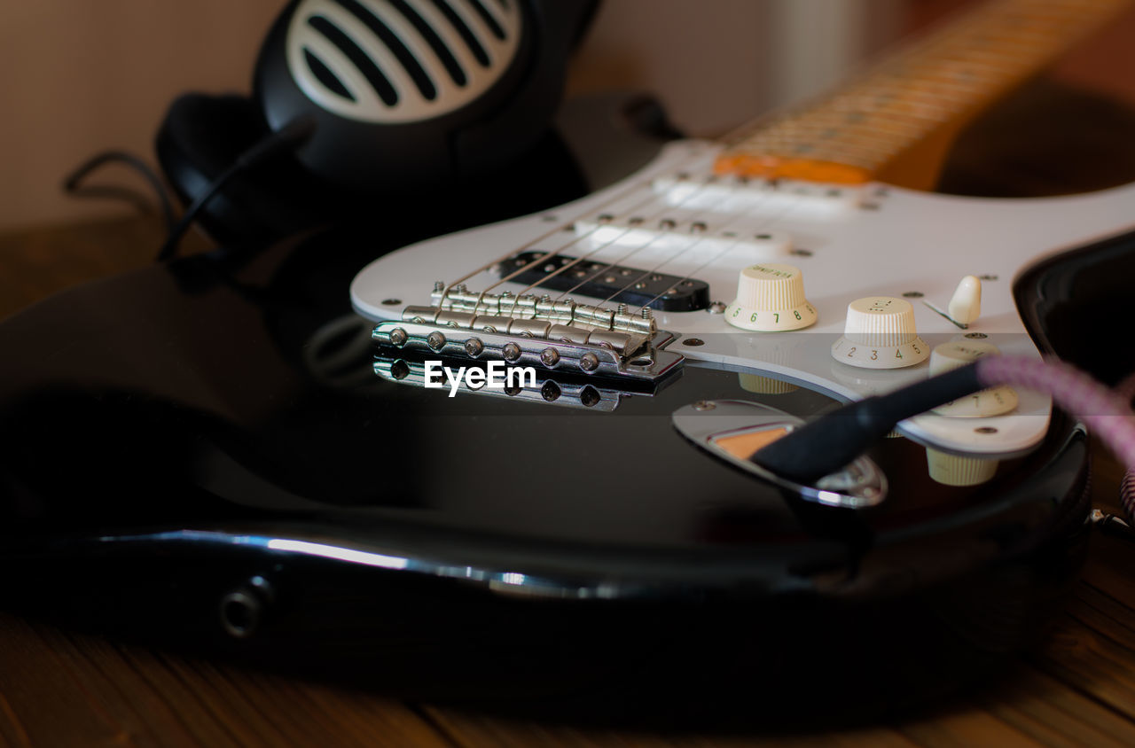 Close-up of guitar on table