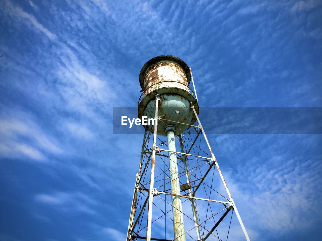 Low angle view of watertower against sky