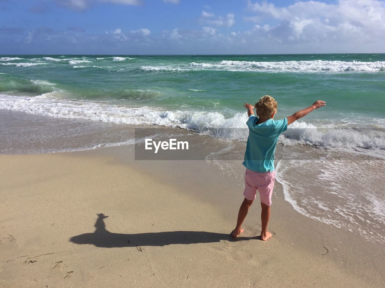 Child standing on beach