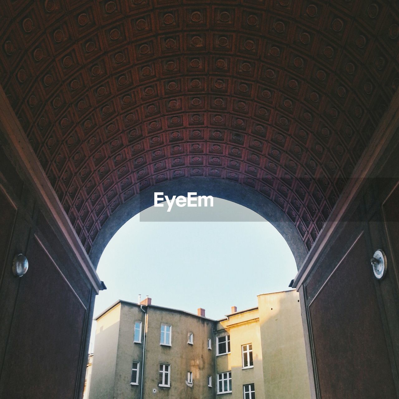 Building against sky seen through arch