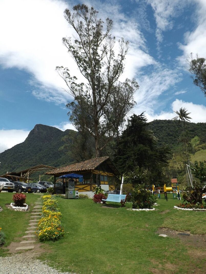 SCENIC VIEW OF MOUNTAIN AGAINST CLOUDY SKY