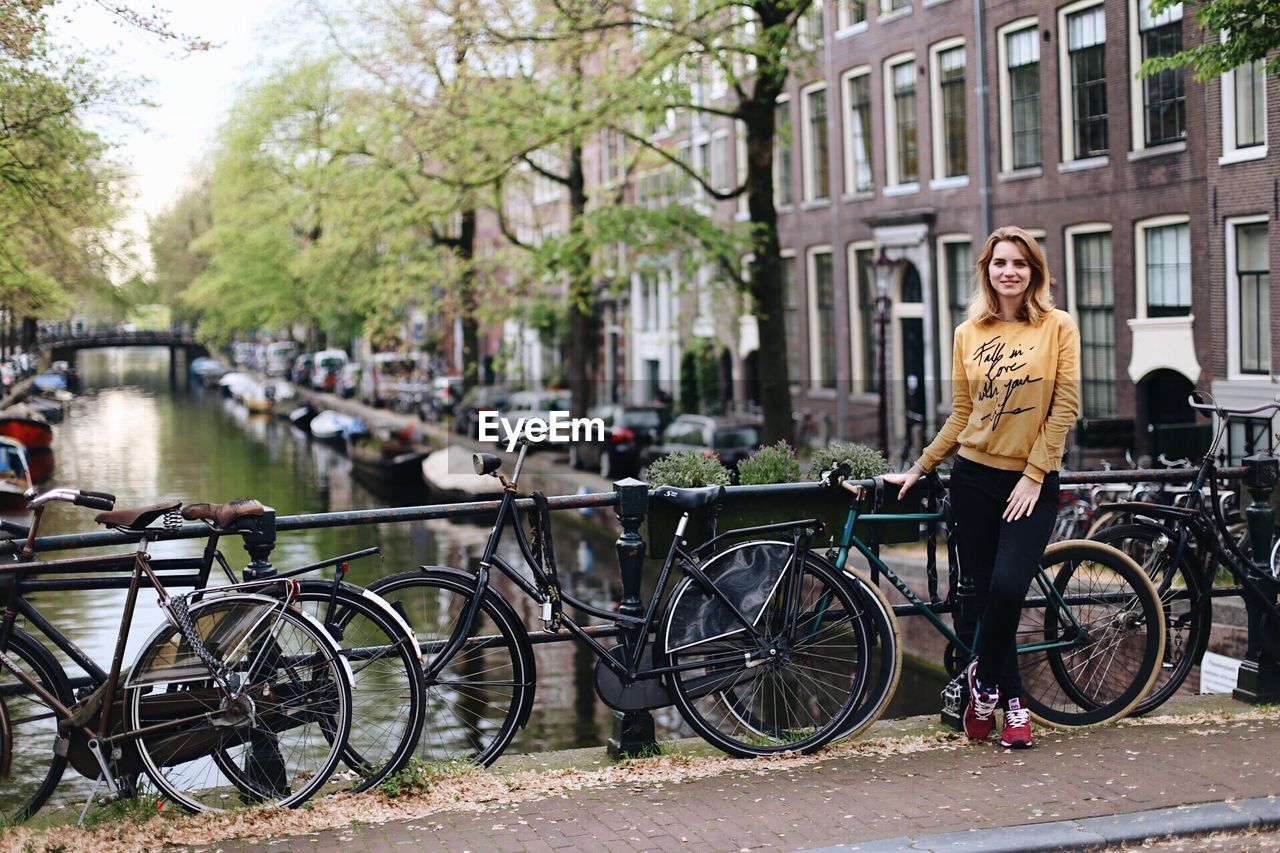 BICYCLES PARKED BY CANAL