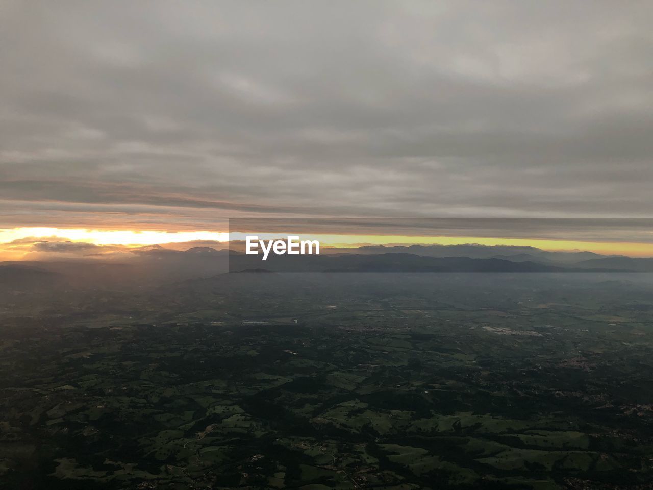 AERIAL VIEW OF LANDSCAPE AGAINST SUNSET SKY