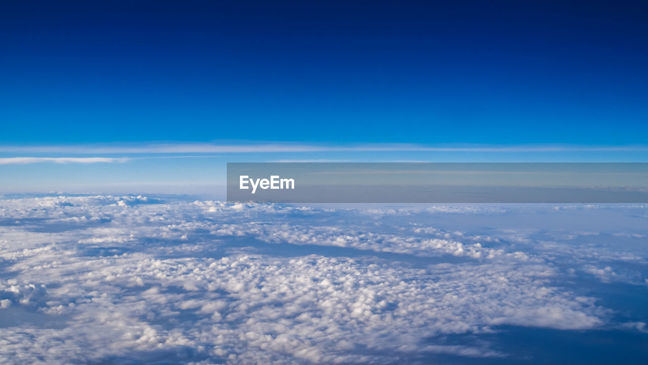 Beautiful clear blue sky over scattered of white clouds.