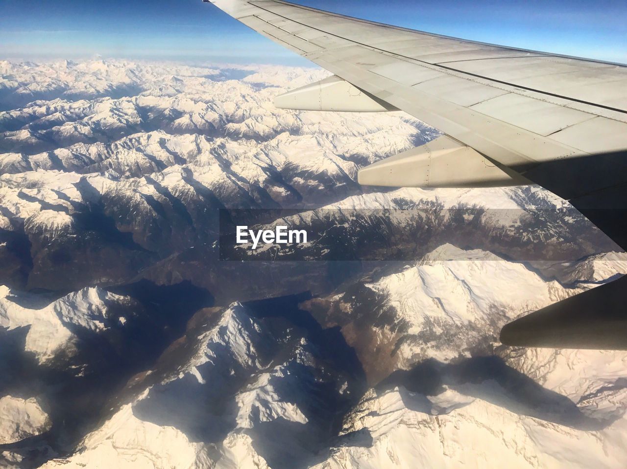 AERIAL VIEW OF LANDSCAPE WITH AIRPLANE WING