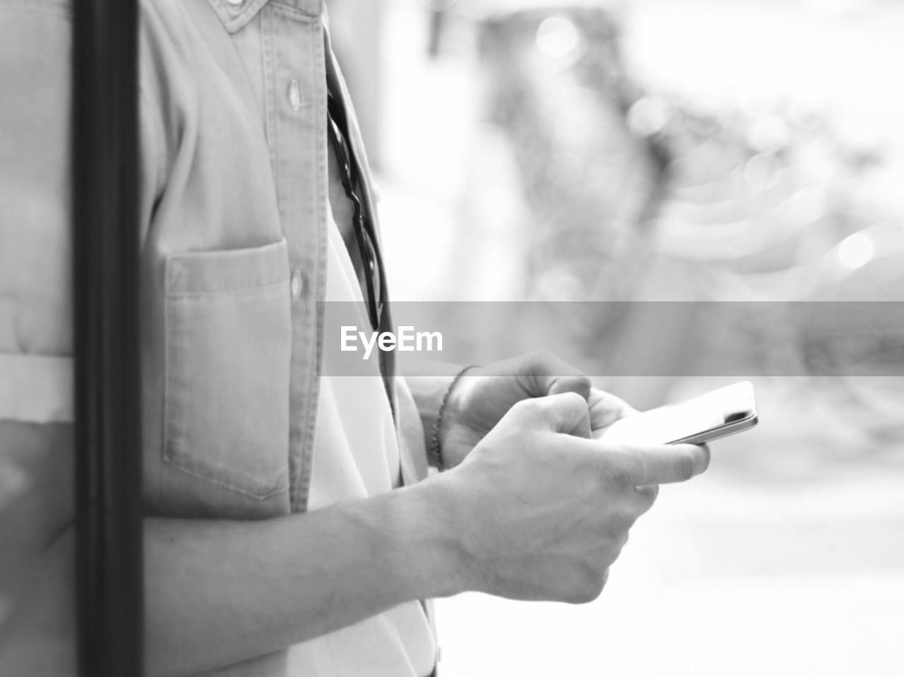 Midsection of woman using mobile phone