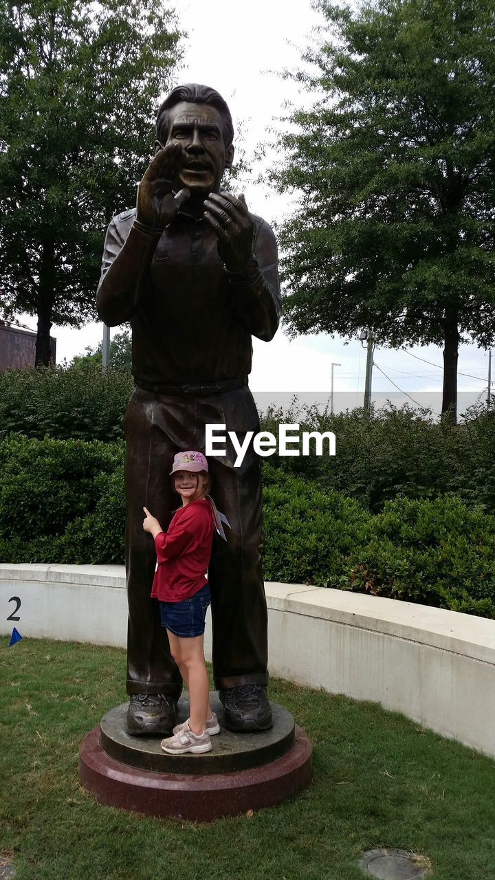 STATUE OF WOMAN IN PARK