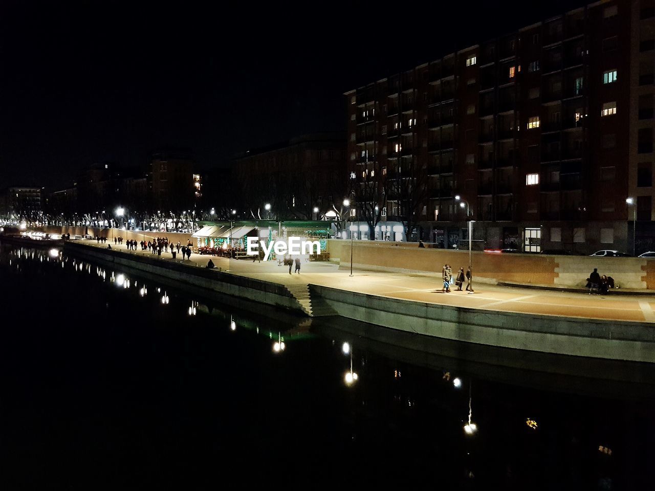 ILLUMINATED CITY AGAINST SKY