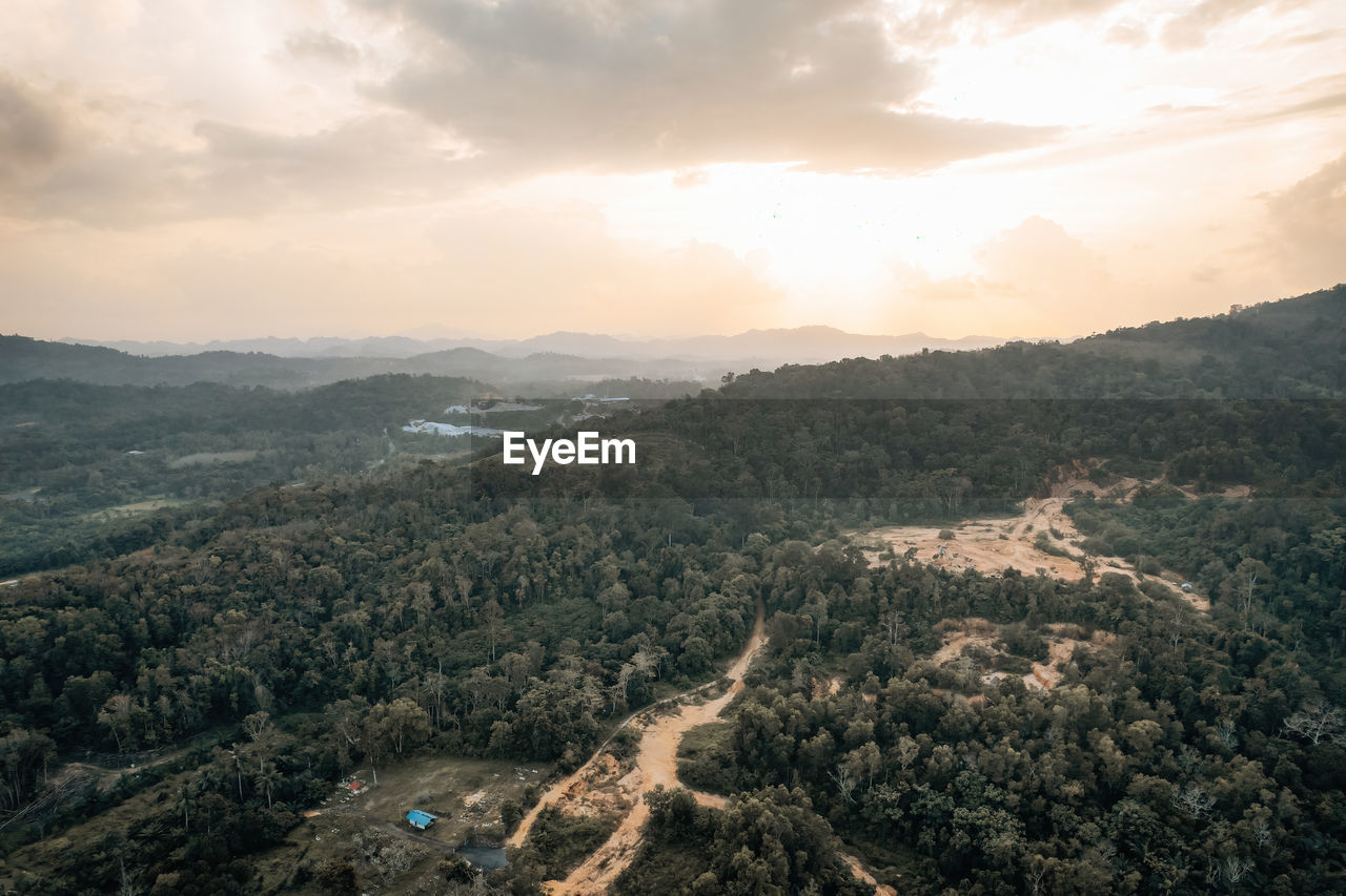 high angle view of trees and mountains against sky