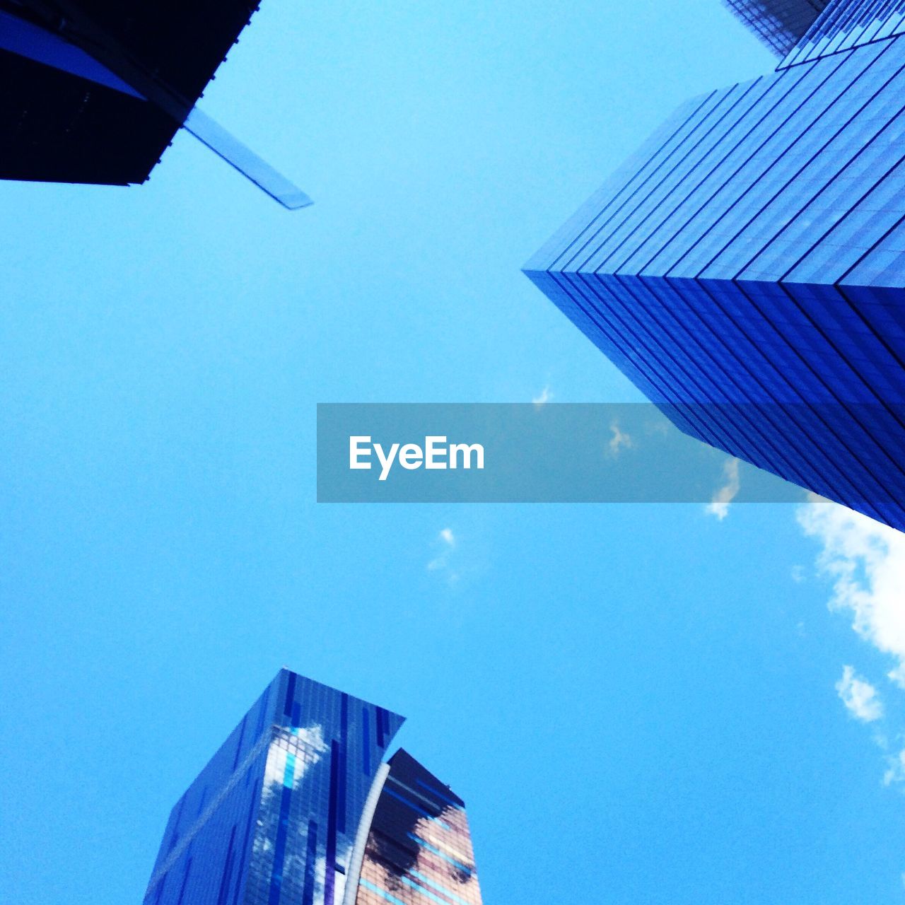 Directly below shot of modern buildings against sky