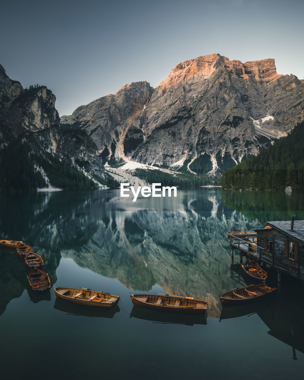 SCENIC VIEW OF LAKE AGAINST MOUNTAIN RANGE