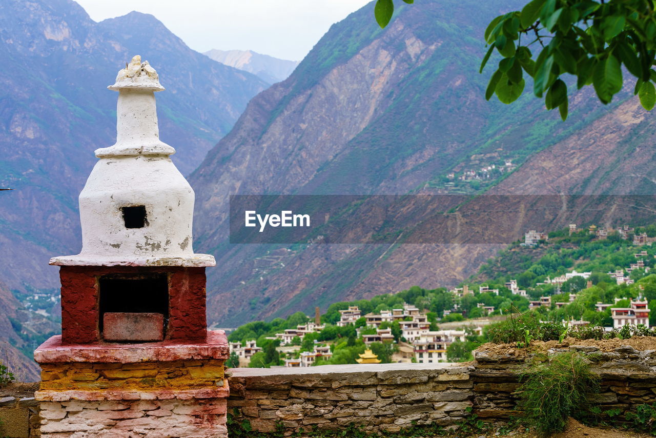View of tibetan tower with mountain in background