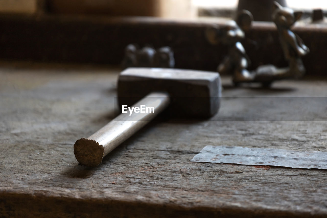 Close-up of hammer on table